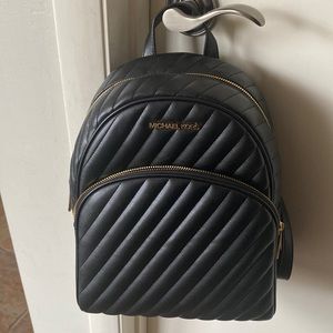 Lovely Michael kors backpack. Took the tags off but never used.